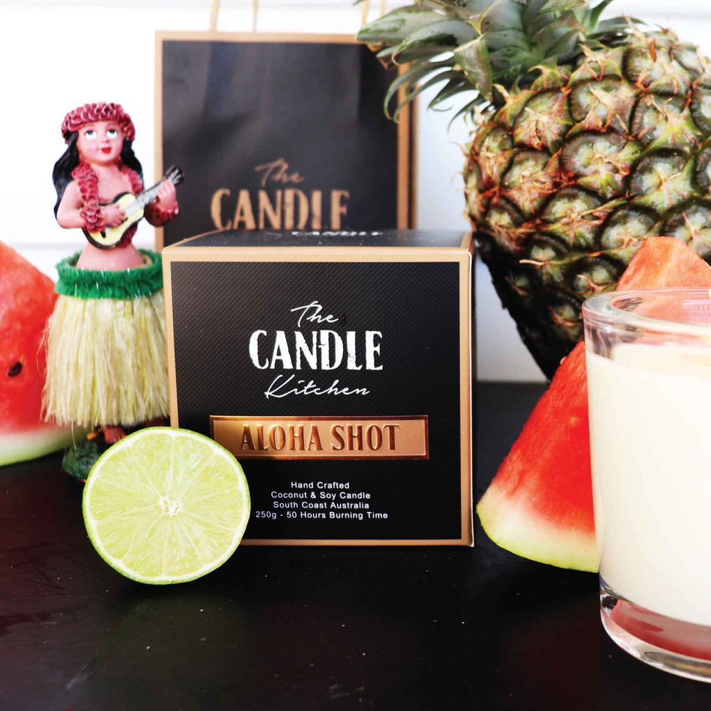 A retro dancing Hawaiian girl, a sweet watermelon, papaya and lime, An irresistible classic. Aloha Shot Candle from the Candle Kitchen.