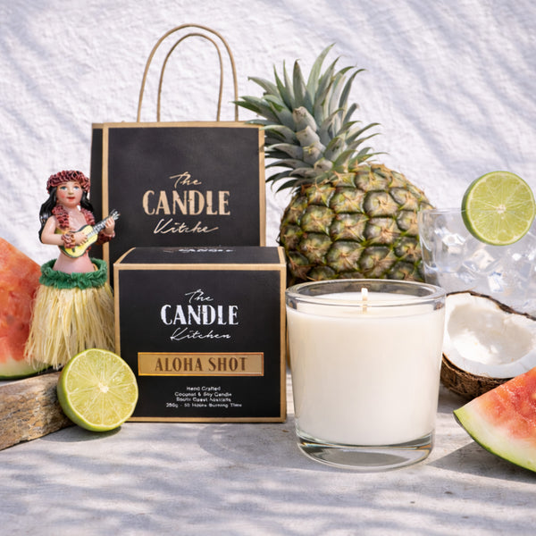 Aloha Shot Soy Candle The Candle kitchen, Candle with 'The Candle Kitchen' packaging, pineapple, lime, and watermelon on a white background
