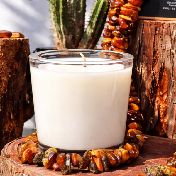 Amber Road Soy Candle The Candle kitchen, A Creamy white Candle from the Candle Kitchen , chunky amber stones surrounded by rich red wood.