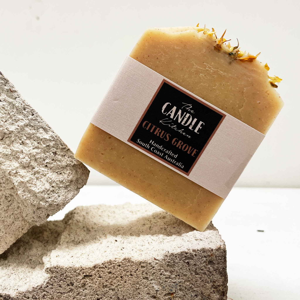 Bar of soap with a label on a stone surface