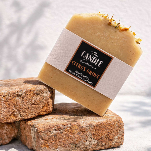 Soft yellow bar of soap on old bricks