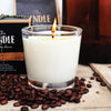 Candle in a glass jar with coffee beans and a branded candle box in the background. Coffee Creme Candle