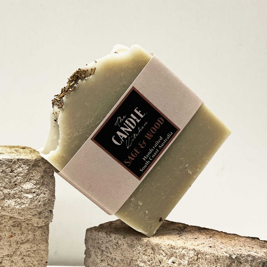 Bar of soap with a label on a stone surface