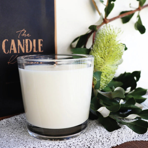 A candle from the South Coast of Australia with a Banksia flower .