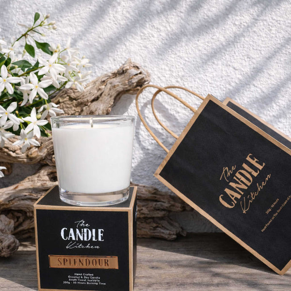 Splendour Soy Candle The Candle kitchen, Candle with packaging and flowers on a textured surface