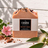 Desert Rose handmade soap, the candle kitchen surrounded with geranium and lemon myrtle flowers sitting on Australian red clay